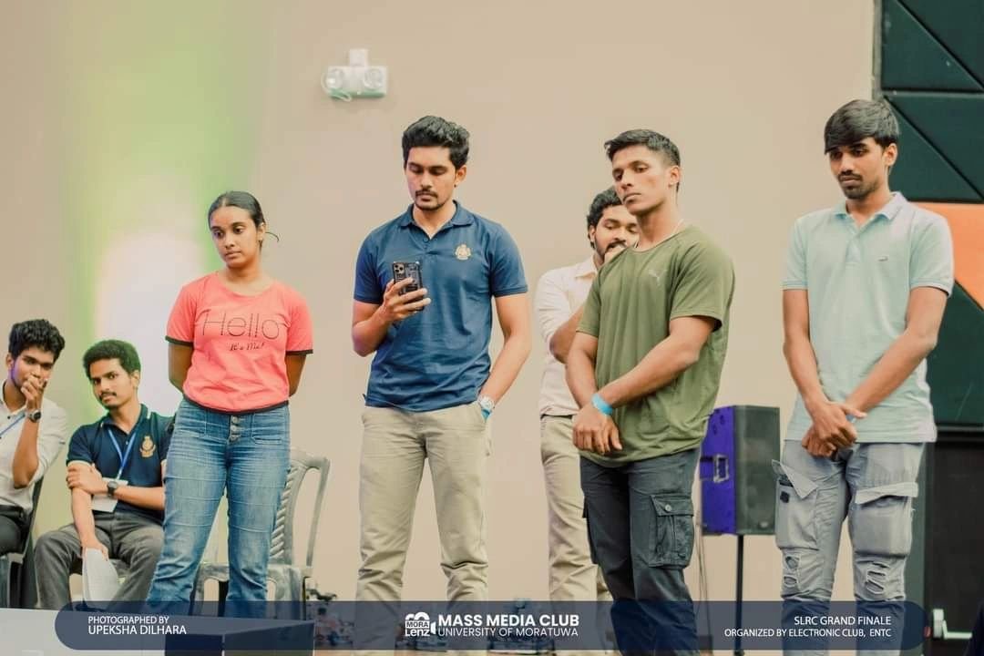 Team Panthera standing beside the competition area