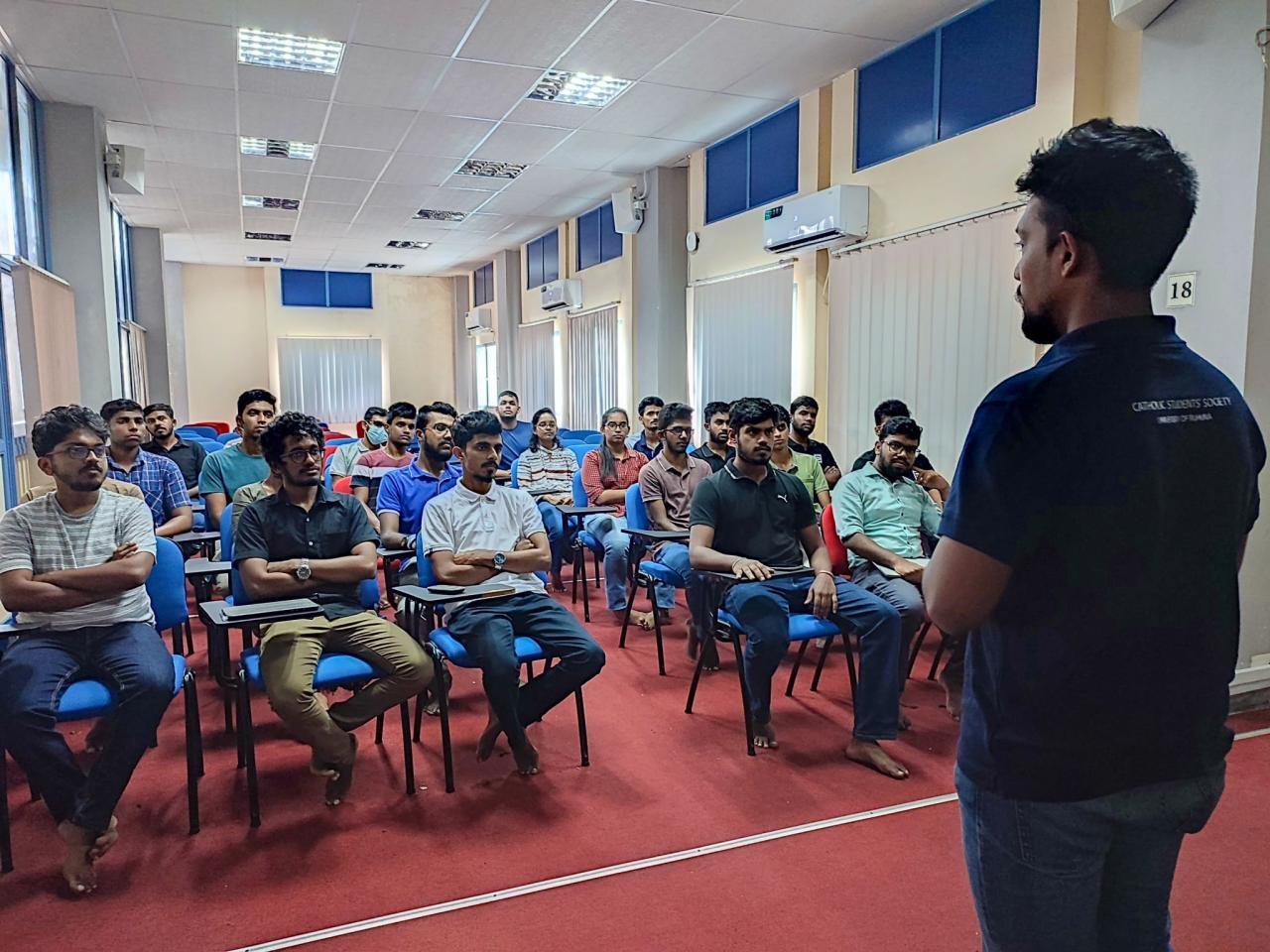 Project Raptor briefing with students seated in a university lecture room