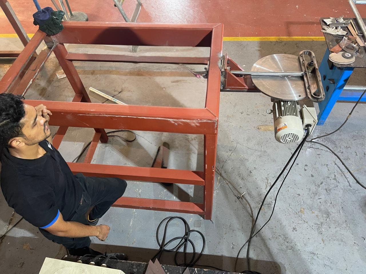 Workshop prototype of the siever with a fabricated steel frame, mounted electrical motor, rotating drive disc, and Scotch Yoke linkage